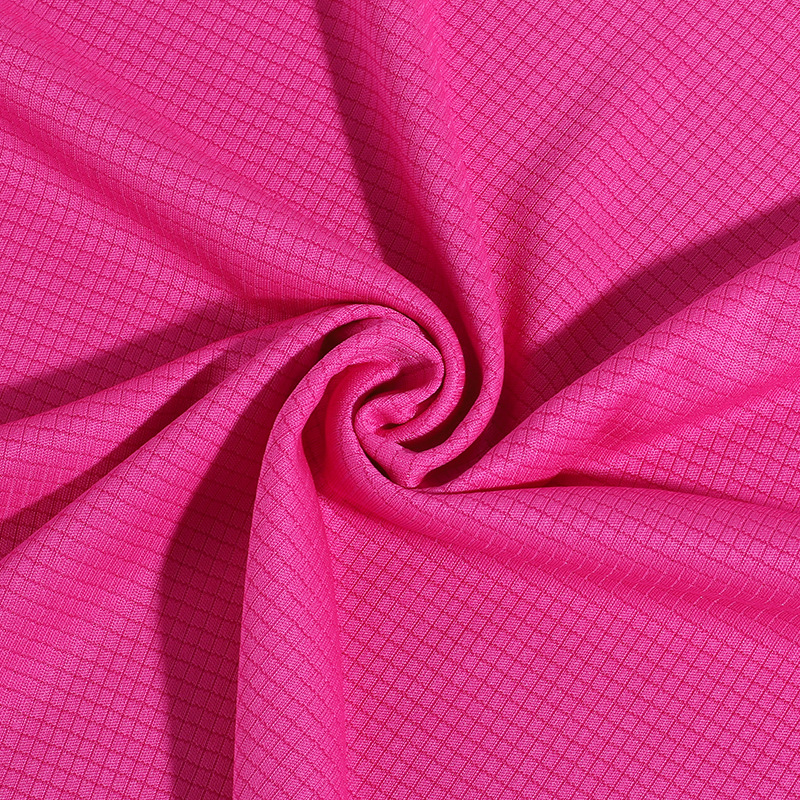 玫红色四季吸湿方格布 全涤沦服装运动服面料 运动工作服材质布料