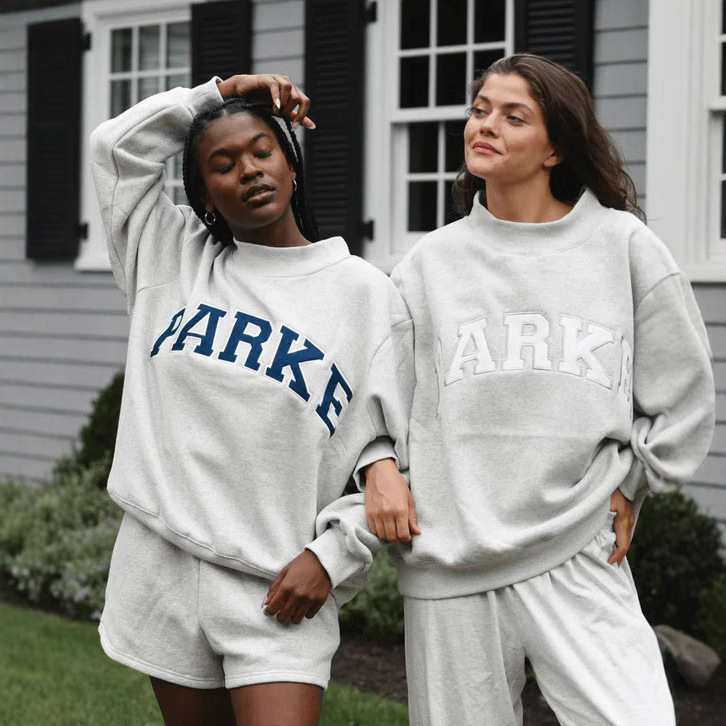 Light gray turtleneck-white letters