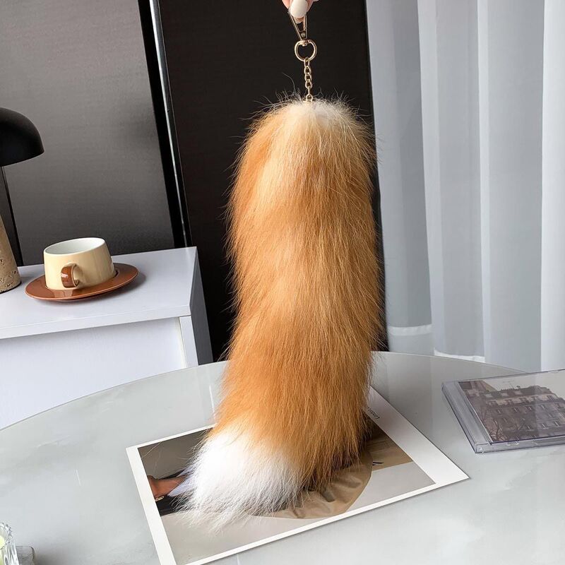 Korean-style cute faux fox fur car keychain with a large tail, a personalized and minimalist plush bag charm Korean-style cute faux fox fur car keychain with a large tail, a personalized and minimalist plush bag charm