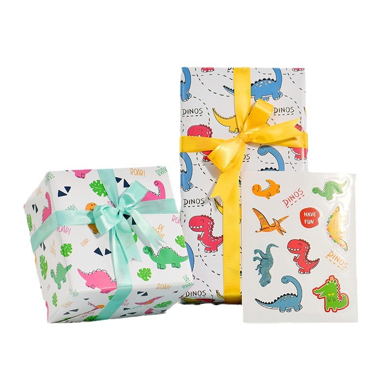 Nuevo papel de embalaje de regalos transfronterizos Día de los niños cartón de dibujos animados papel de caja de regalo de cumpleaños lindo papel de embalaje de regalos de dinosaurios animales