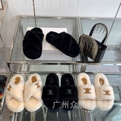 高バージョンの凱旋門の本革の毛のスリッパの女性はウールの厚い底のスリッパを履いています。