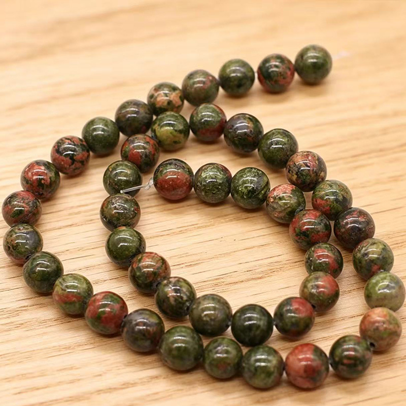 Los fabricantes suministran directamente collares de pulsera de cuentas dispersas de cuentas redondas de esmeralda natural DIY joyas semiacabadas al por mayor