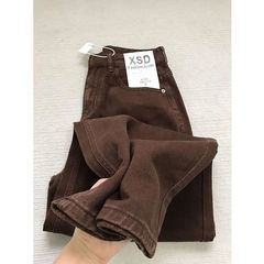 アメリカのレトロなカレーの色の狭い版のストレートジーンズの女性の秋冬の新型の高い腰はゆったりしていて痩せています。