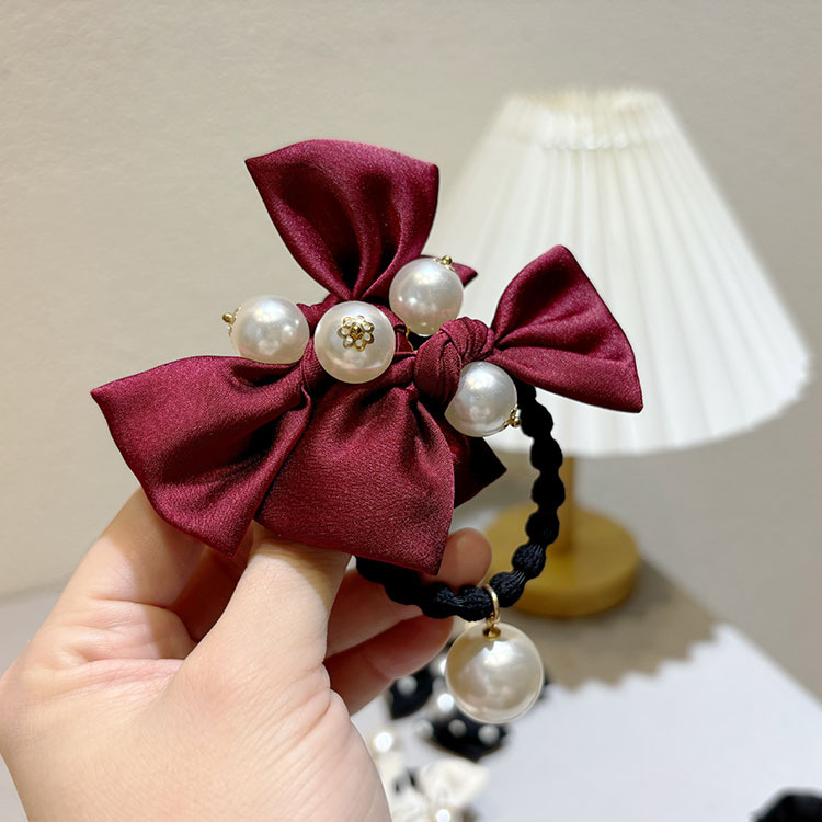Elastico per capelli in raso a pois con fiocco e perla elegante_voghion.com