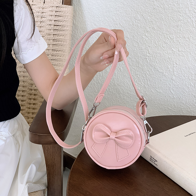 Hermosa bolsa de hombro para chicas de arco, mini bolsa de bebé simple de color sólido, bolsa de cambio para niños de moda