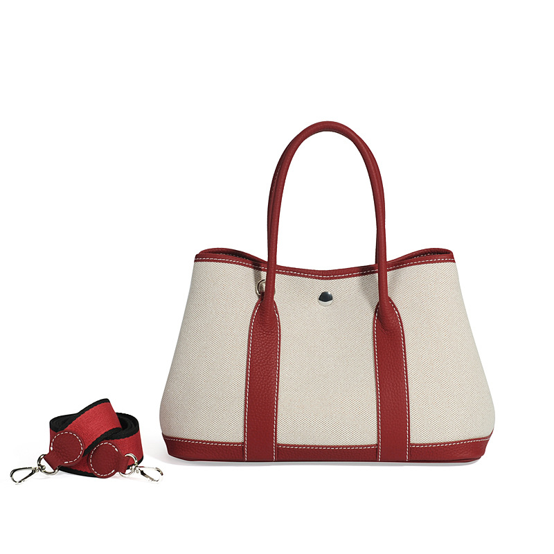 大容量ガーデンバッグキャンバスは色にぶつかった本革のトップ層牛革をつなぎ合わせて、シングル肩のショッピングバッグを持っています。