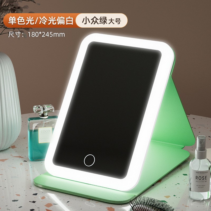 Espejo de maquillaje LED espejo de belleza plegable espejo de maquillaje de escritorio carga con luz de tres colores espejo de relleno de luz entrega al por mayor