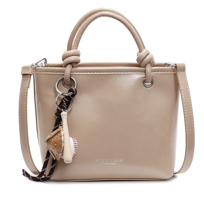 Bolso de mano súper caliente para mujeres 2025 nuevo estilo universal simple de hombro mochila de moda casual bolso de cubo