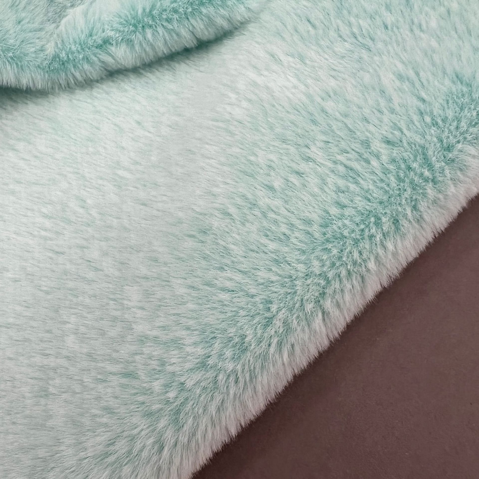 Tela de piel de conejo de dos colores con fondo de impresión trasera en stock