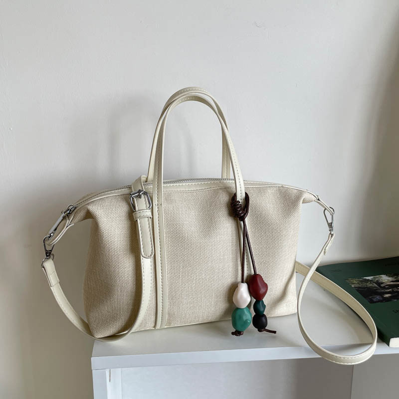 Bolsa de mano de gran capacidad de viaje coreano para mujeres 2026 nueva moda de verano simple bolsa de hombro retro
