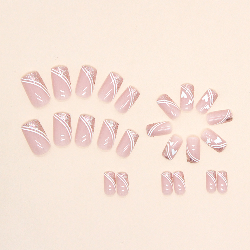 Style français explosif européen mi-long portant une armure, mignon et attentionné, lignes minimalistes, pièces de nail art, faux ongles_voghion.com