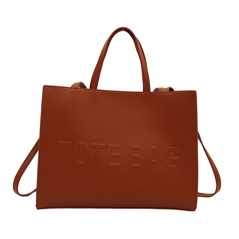 2024 nueva gran capacidad simple mochila de hombro texturizada bolso de mano letras de impresión clase viaje bolsa de mano