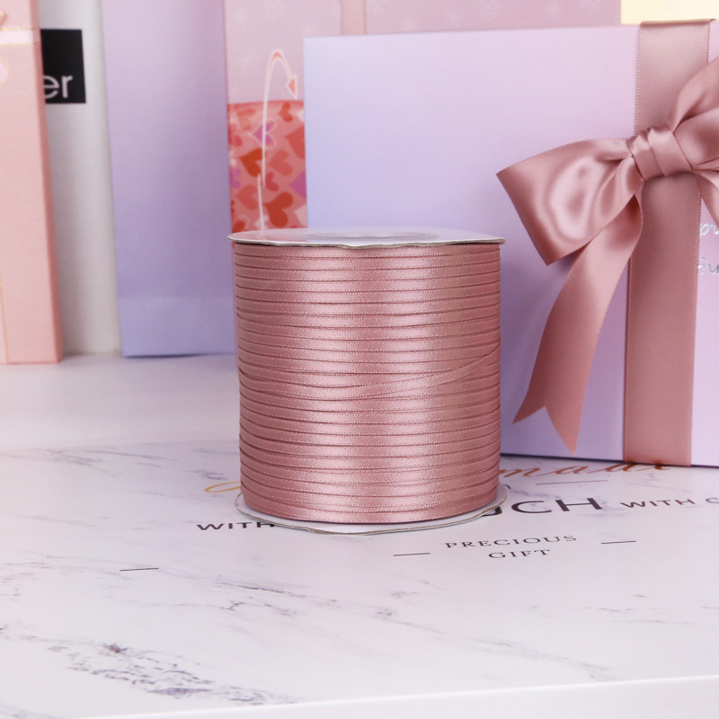 Un solo lado de poliéster cifrado cinta de boda festiva embalaje cinta accesorios de ropa 161 lotus polvo cinta de color fábrica al por mayor