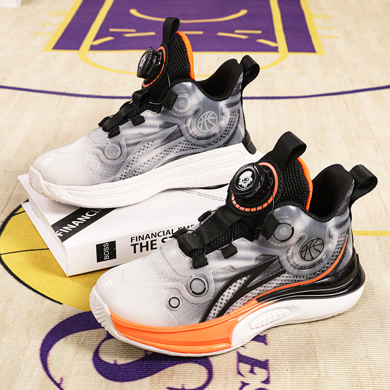 Zapatos de baloncesto permeables para niños 2025 primavera y verano nuevos zapatos infantiles botón giratorio zapatos de fútbol para niños zapatos antideslizantes para niñas