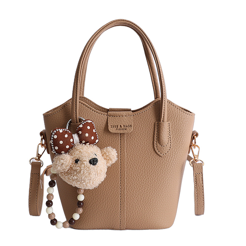 Bolso de mano de moda retro 2026 nuevo temperamento simple bolso de cubo de viaje ocio mochila de hombro
