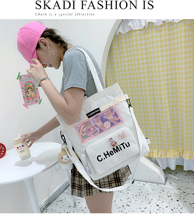 Korean-style canvas bag for girls with one shoulder, in the style of Harajuku, ulzzang, with a large capacity and contrasting colors, is a crossbody hand-held schoolbag for classes undefined