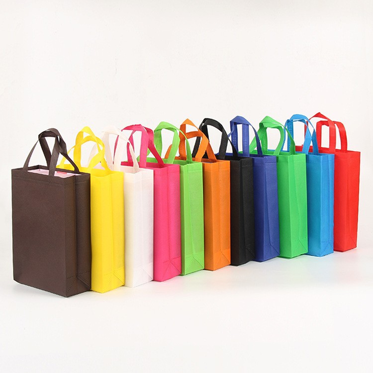 Bolsas de tela no tejida de gran tamaño recubiertas de película de mujer en stock bolsas de compras prensadas en caliente fijas pueden imprimir bolsas de publicidad LOGO