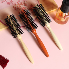 子供の男性専用の木巻き櫛にまたがって、理髪店のヘアサロンの専門円筒を作って、外国貿易櫛を転がします。