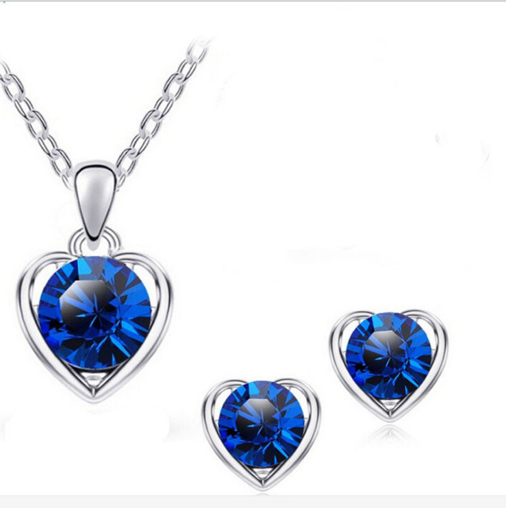 Directo de fábrica al por mayor en stock moda cristal Corazón en forma de corazón collar pendientes anillo pulsera conjunto de cuatro piezas