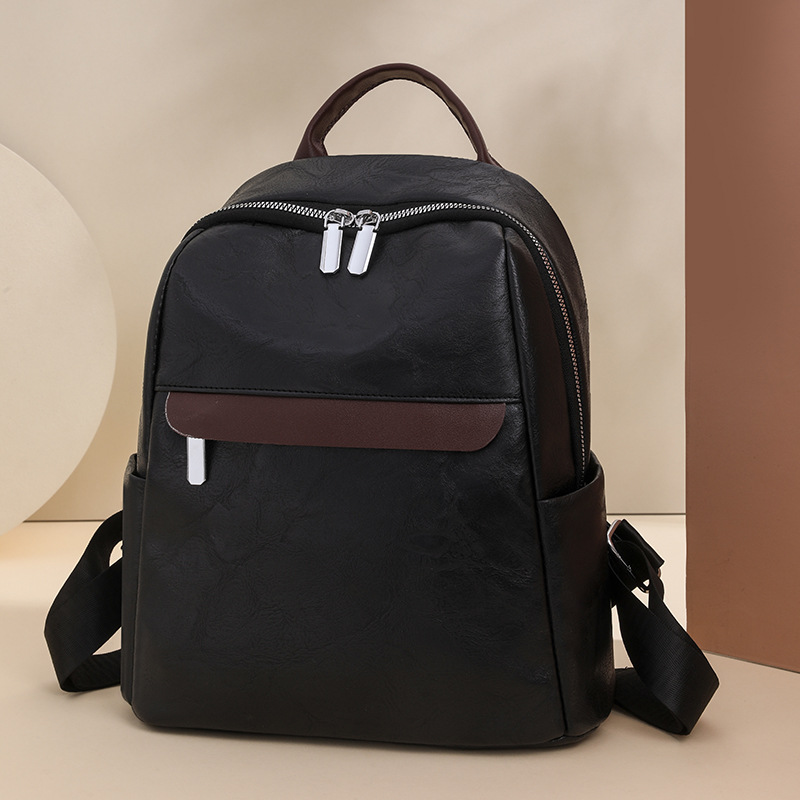 Mochila casual de cercanías 2024 nueva moda simple de gran capacidad para salir bolso de mujer de todo fósforo bolso de estudiante de cuero suave