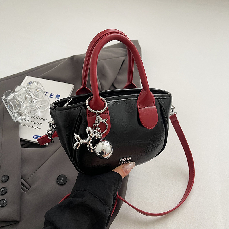 Alta sensación de contraste bolsos pequeños para mujeres 2024 nuevo verano popular bolsa de mensajero versátil Super Fire bolsa de cubo de mano