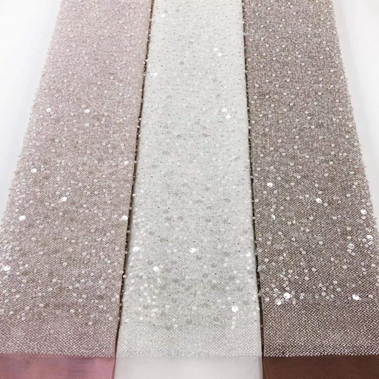 Fabricantes de comercio exterior transfronterizo punto bordado de polvo de polvo brillante tela vestido de boda ropa de moda tela