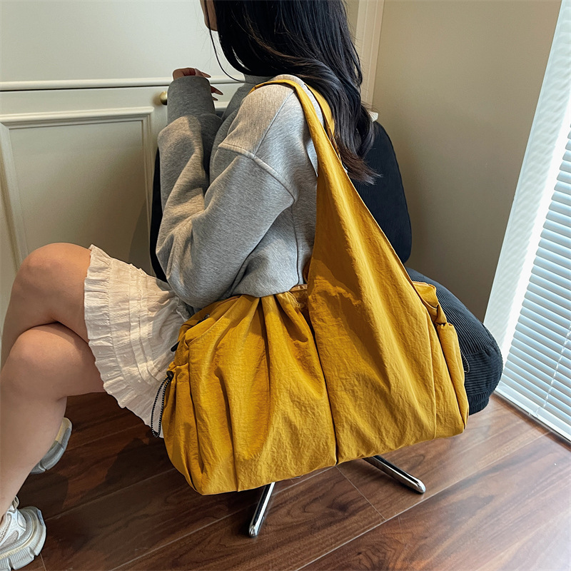 Capacious shoulder bag