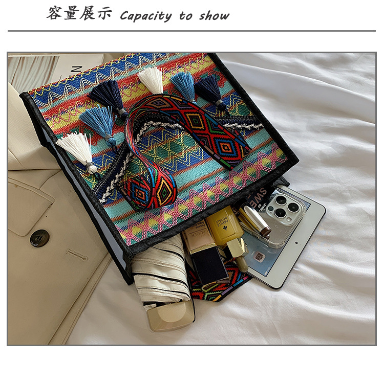New hand-held fringed shopping bag 2022, fashionable ethnic style, Hong Kong style bucket bag, versatile woven bag for women undefined