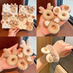 秋冬のかわいいウサギの耳の毛の輪の子供は髪のひもの輪を刺します。