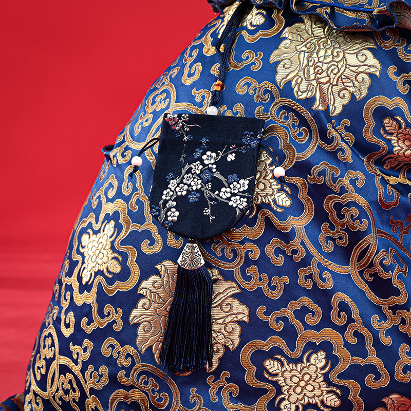 Nueva mascota Año nuevo perro ropa Año Nuevo festivo suerte bolsa Tang traje cheongsam mediano y pequeño perro peluche una generación