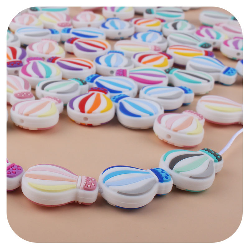 Creativo DIY bebé suministros de dibujos animados de silicona color globo de aire caliente juguete mordedor bebé molar chupete cadena Accesorios
