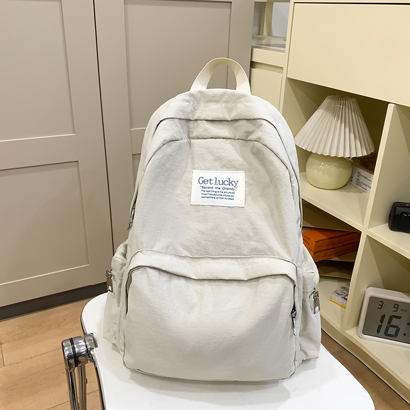 2025 nueva mochila para estudiantes universitarios japoneses, mochila escolar ligera, mochila de viaje simple, impermeable y de gran capacidad