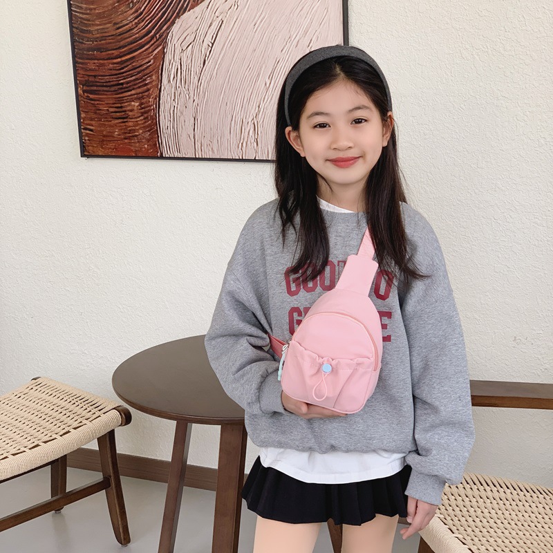 Bolso de pecho simple de color sólido para niños y niñas, bolso de ocio, bolso de mochila infantil ligero, 2026 nuevo bolso de cambio para niños