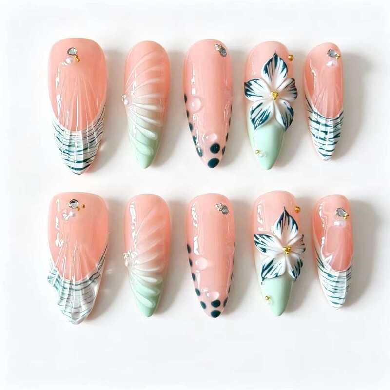 Handmade press-on nails, sheer nude base with sea blue floral and 3D butterfly shell designs, long almond shape, fresh seaside vacation look Handmade press-on nails, sheer nude base with sea blue floral and 3D butterfly shell designs, long almond shape, fresh seaside vacation look