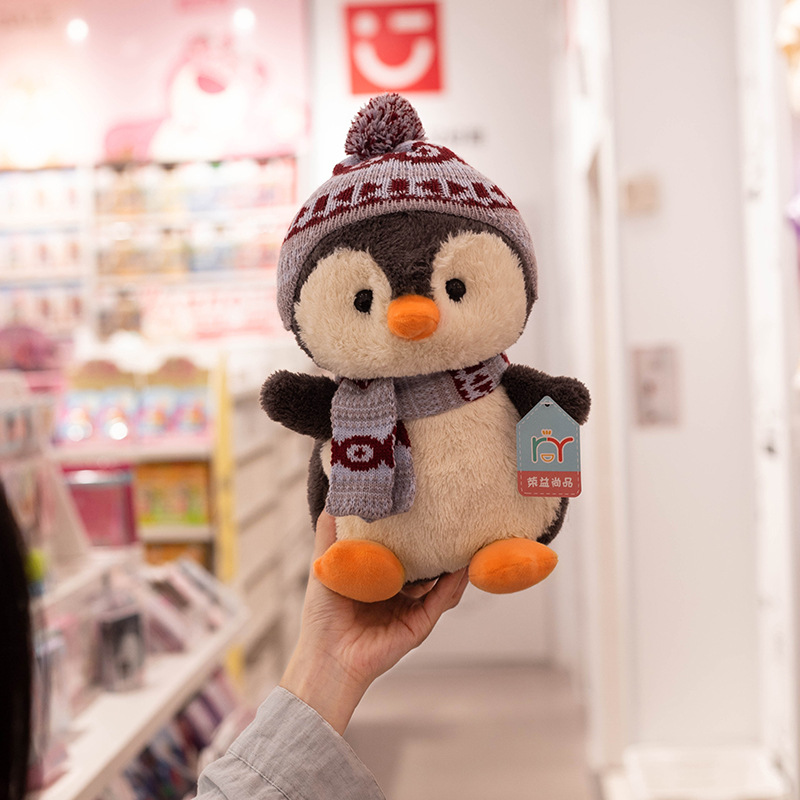 Bonitos pingüinos juguetes de peluche bufandas de invierno muñecas de dibujos animados niños mochilas agarrar muñecas al por mayor muñecas noreste