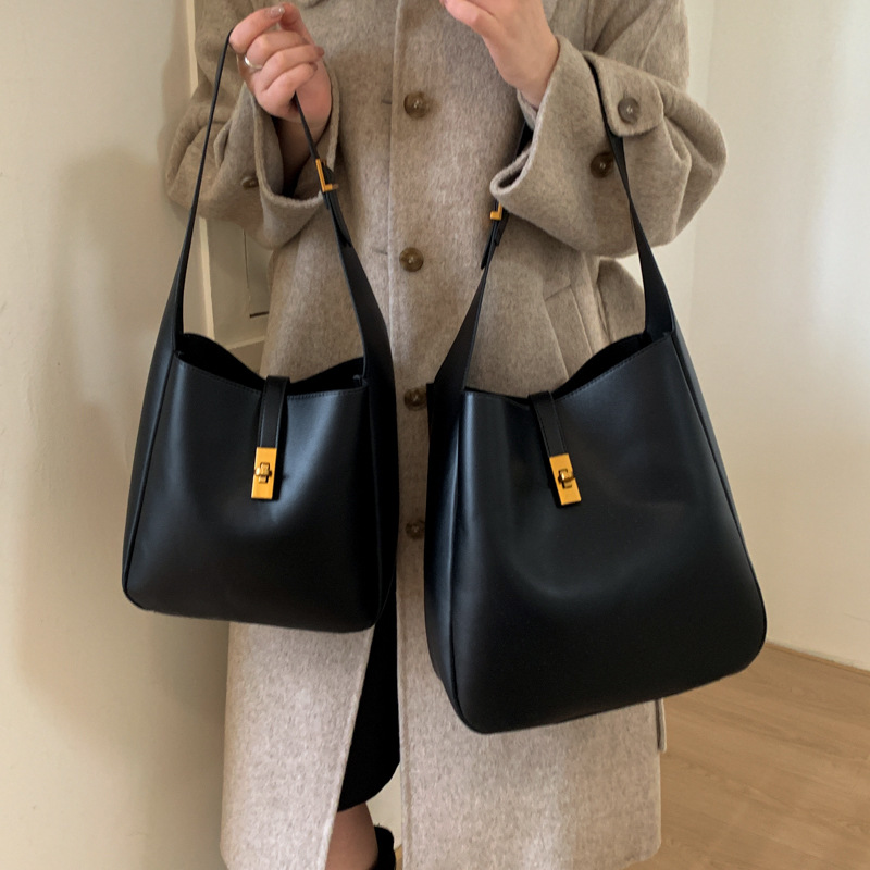 Transfronterizos de alto nivel sensación de cuero suave bolso de cubo de gran capacidad bolso de viaje para mujeres 2025 nuevo retro bolso de mochila para niños