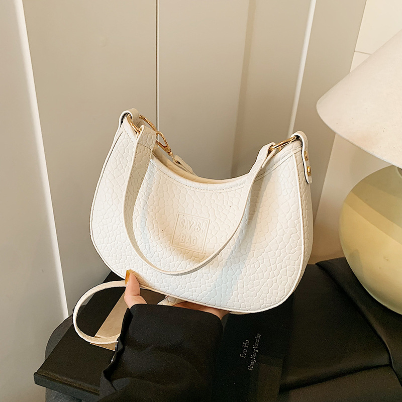 Bolso de moda coreano 2025 verano nuevo bolso femenino moda patrón de lichi bolso de hombro letra simple bolso de mensajero