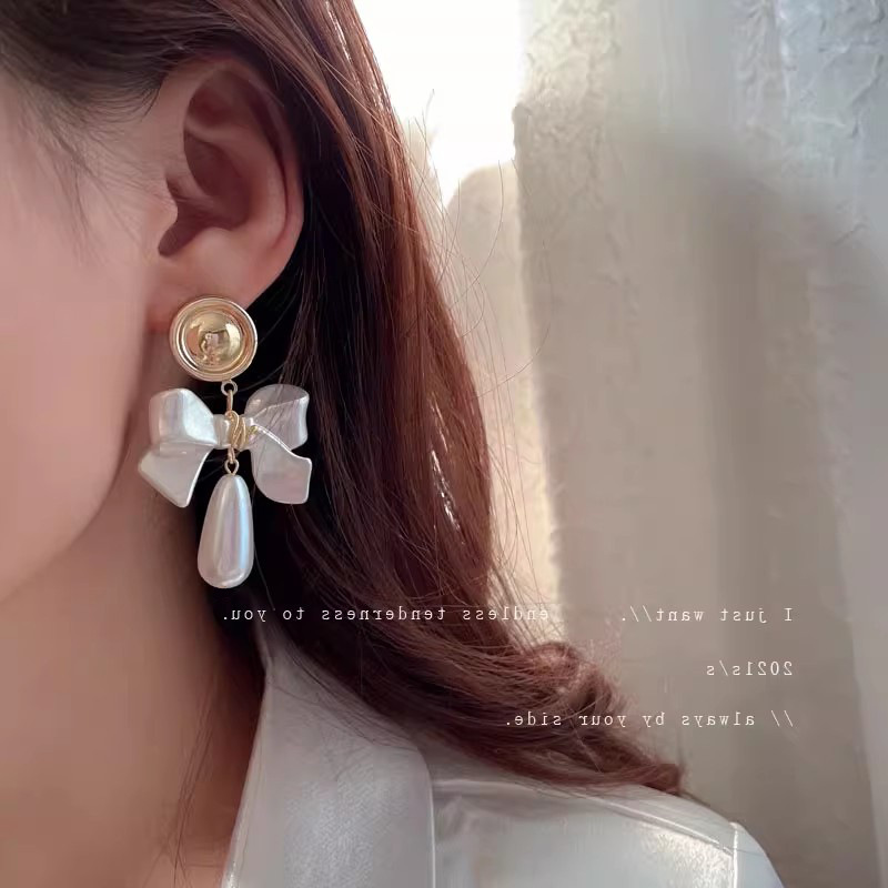 S925 aguja de plata elegante pendientes de nicho femenino diseño de gama alta pendientes populares pendientes de perlas pendientes únicos al por mayor