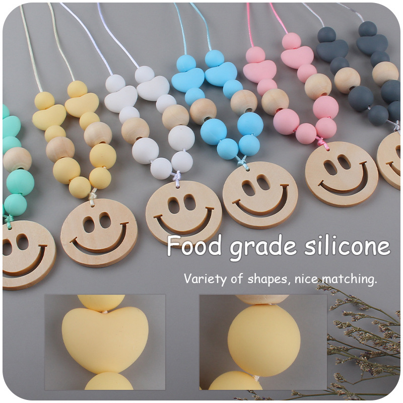 Nuevo bebé suministros smiley cara mordedor collar bebé cuentas de silicona mordida molar masticable colgante collar