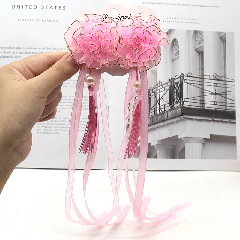 Children's hair accessory with tassels