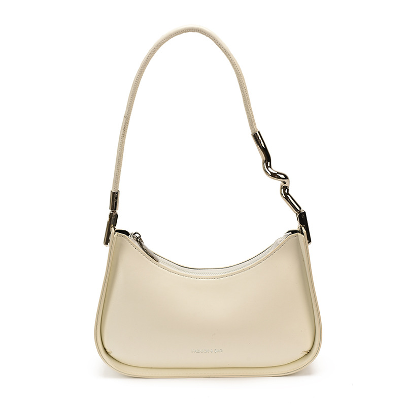 Nicho de diseño bolso de brazo para mujeres 2026 comercio exterior nueva moda alta sensación de viaje simple bolso de media luna de hombro
