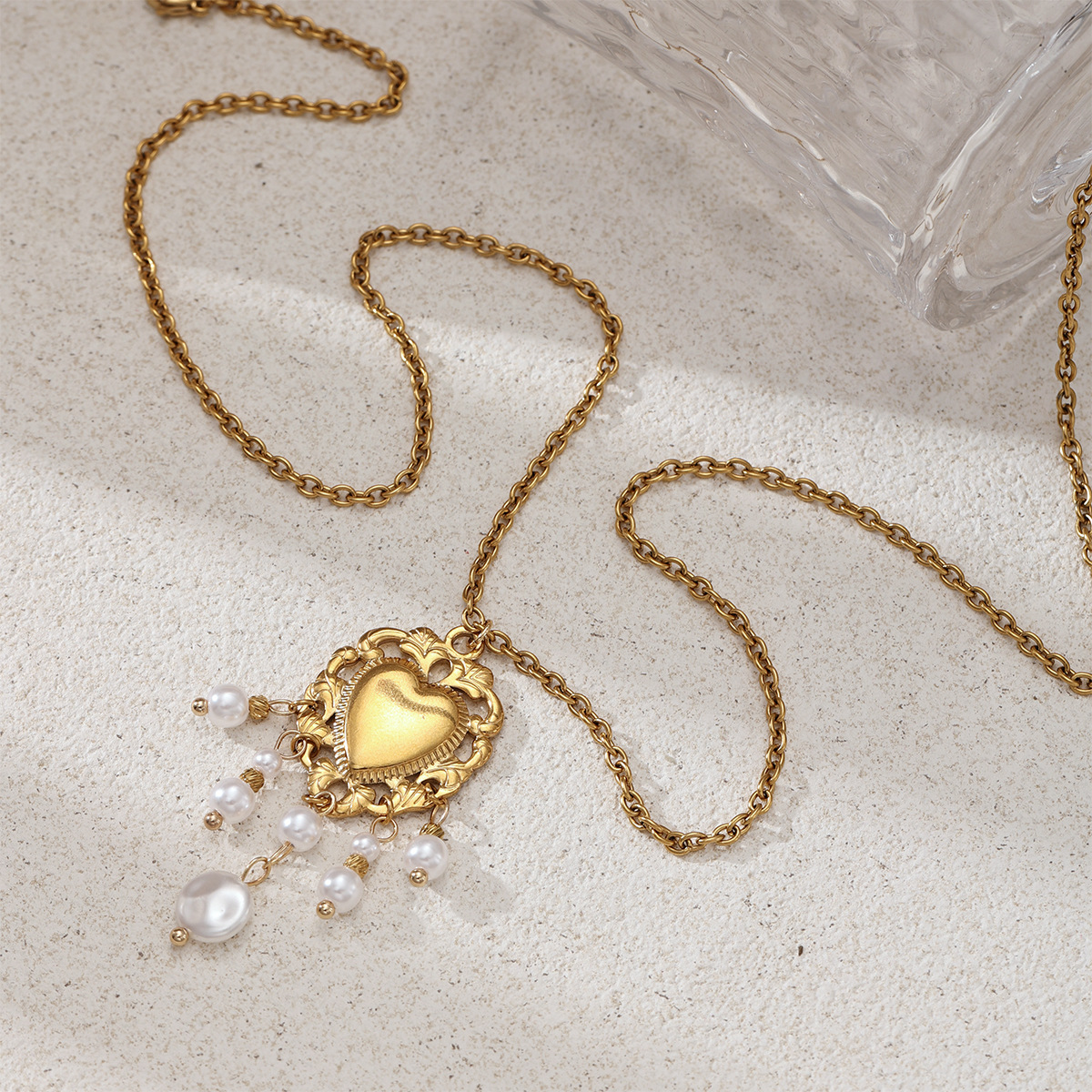 Taina estilo europeo y americano acero inoxidable perla de rosca amor collar pendientes conjunto de joyería de acero titanio para mujeres no desvanecerse transfronterizo