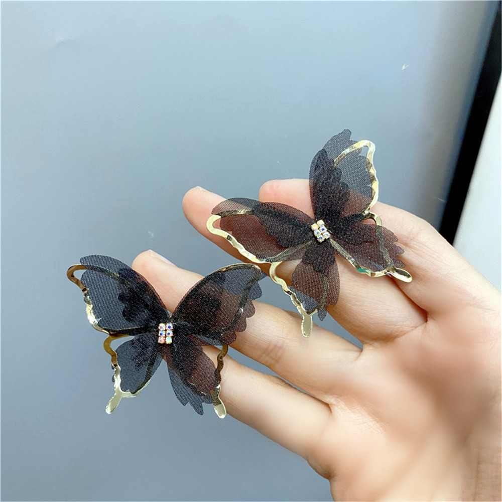 Pendientes Tachonados De Diamantes De Mariposa Hueca De Moda display picture 6