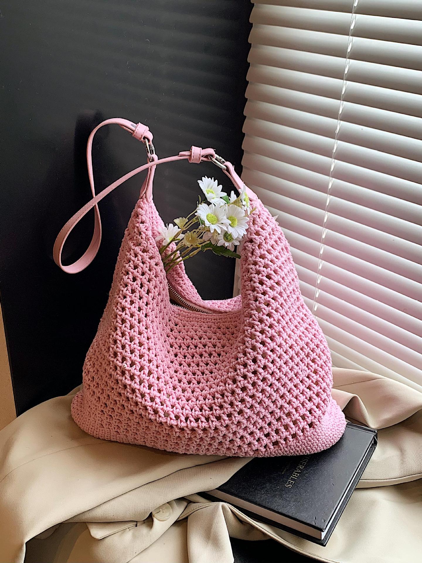 Venta caliente de verano nuevo producto bolsa tejida hueca para mujer 2025 bolsa de playa estilo vacaciones bolsa de paja de gran capacidad bolsa de cubo