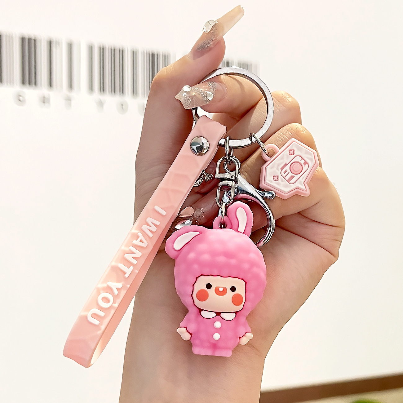 Muñeca de goma goteando bolsas escolares colgantes colgantes de muñecas colgantes de la máquina del mercado nocturno regalos al por mayor llaveros de dibujos animados