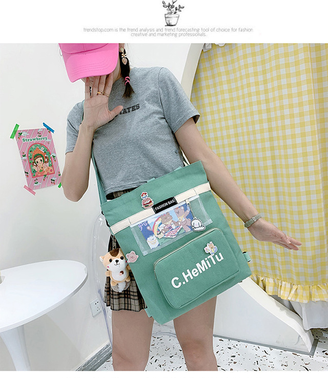 Korean-style canvas bag for girls with one shoulder, in the style of Harajuku, ulzzang, with a large capacity and contrasting colors, is a crossbody hand-held schoolbag for classes undefined