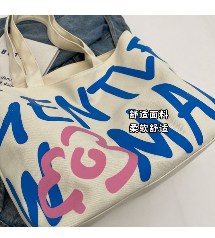 Commuting single-shoulder letter large-capacity versatile bag, canvas bag, Japanese student class artistic bag, women's tote handbag Application Scenario