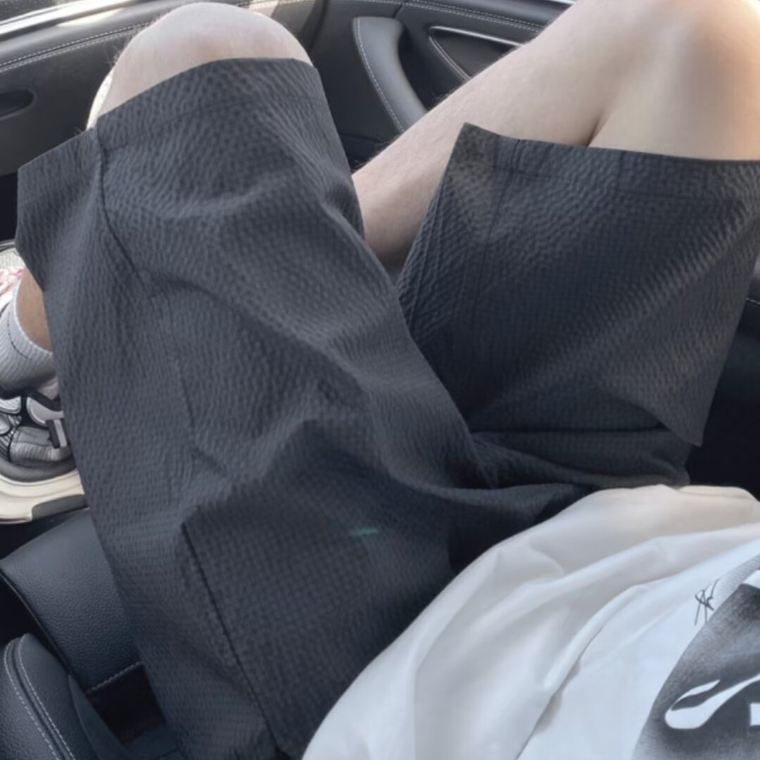 Pantalones cortos de secado rápido a cuadros de burbujas para hombres verano nuevo estilo pantalones de playa de color sólido tendencia americana pantalones delgados de cinco puntos