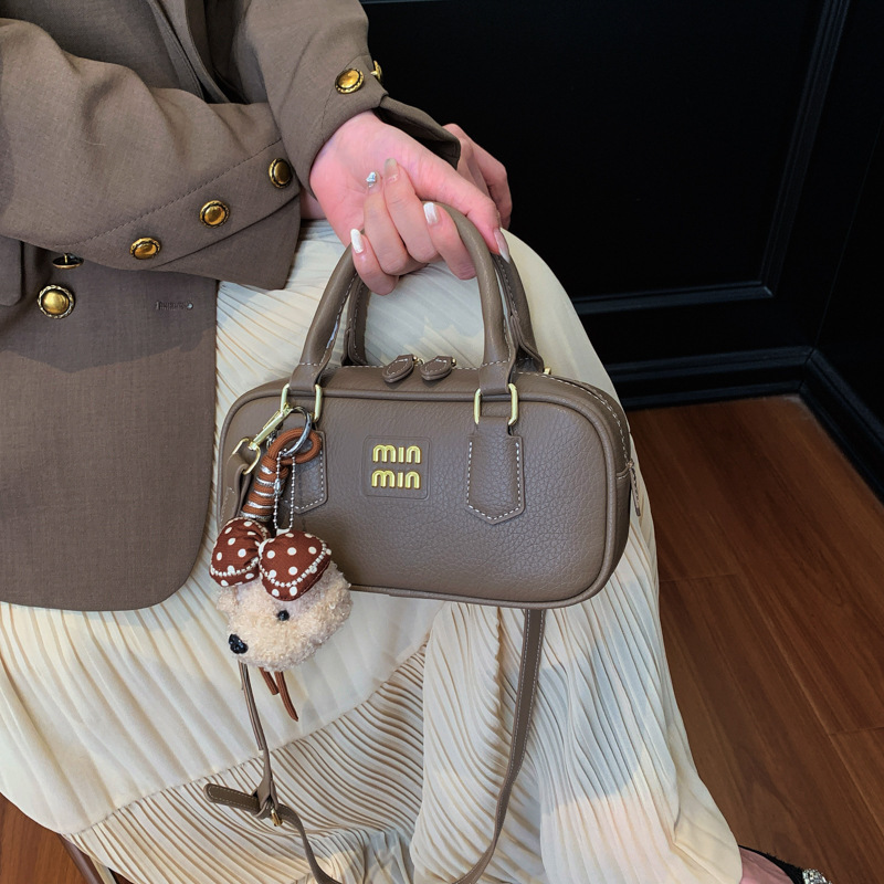 Bolsa de bolos portátil retro para mujeres 2026 nueva moda diaria sensación de bolso cuadrado bolso de hombro universal