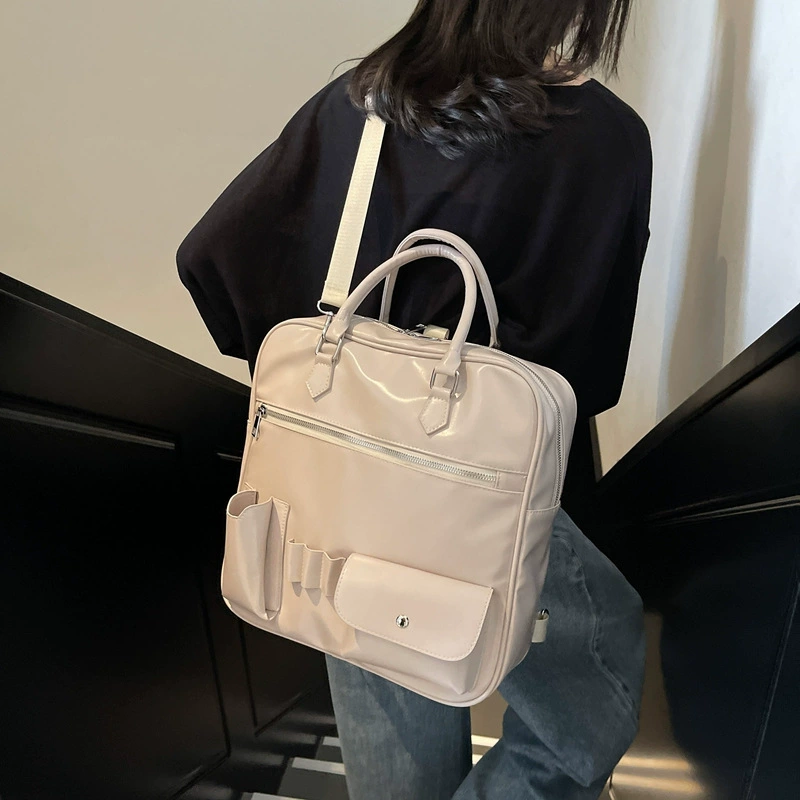 Capacious backpack, handheld bag, trend of season